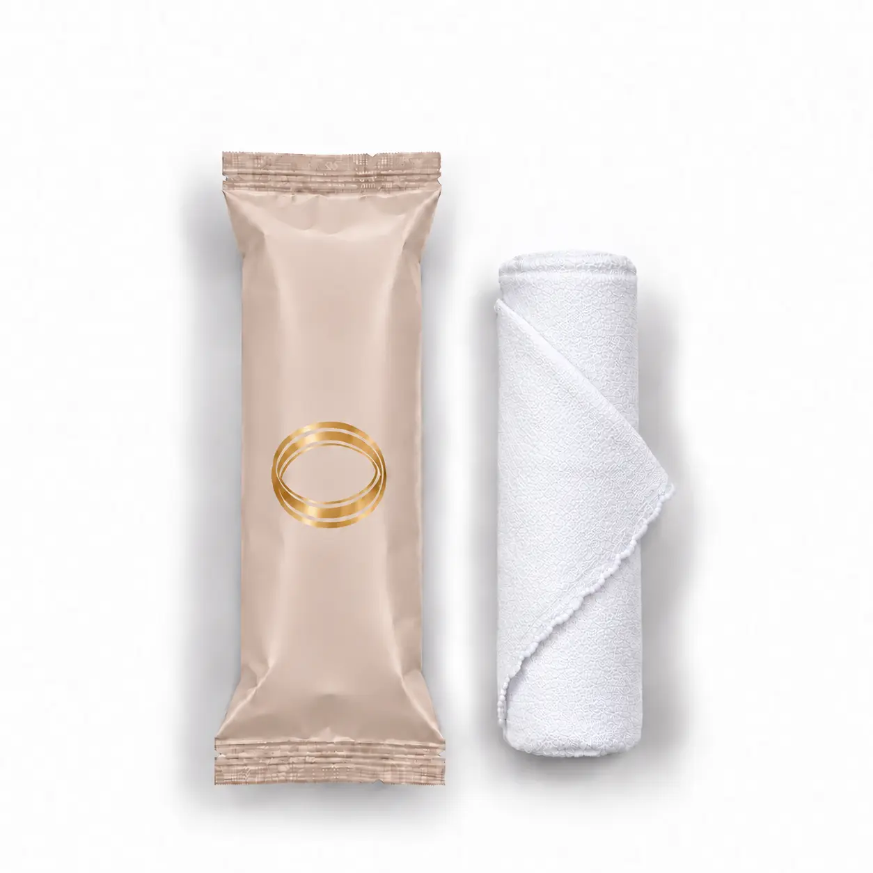 Jasmine oshibori towel in blush beige packaging, shown upright beside the rolled white microfiber towel